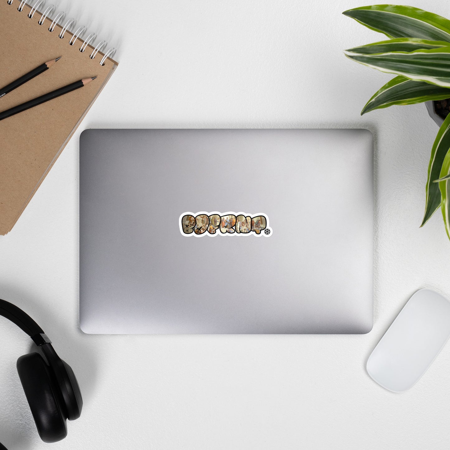 laptop with BDFRNT Throwie x School of Athens Graffiti Sticker from B.Different Clothing, graffiti-inspired streetwear
