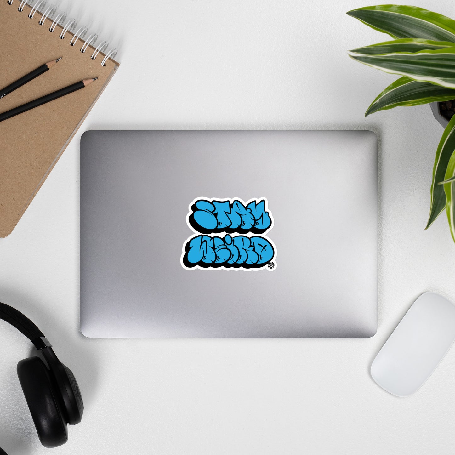 Laptop with Stay Weird Graffiti Throwie Sticker by Monsterinho from B.Different Clothing, graffiti-inspired streetwear