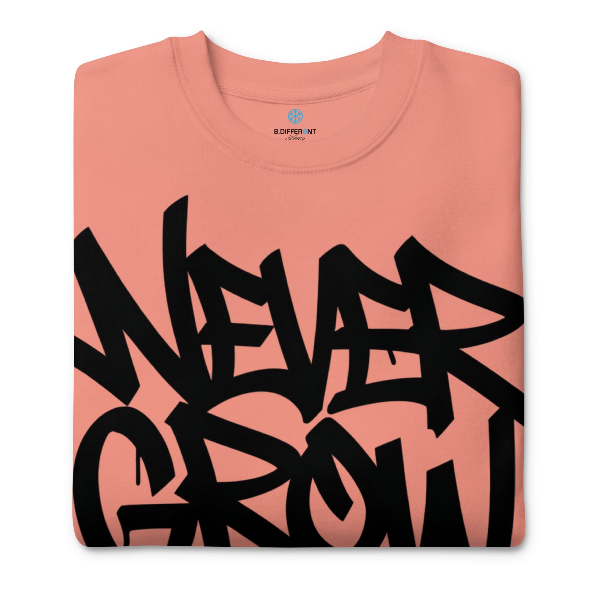 Pink-Never Grow Up Graffiti Sweatshirt from B.Different Clothing, folded, graffiti-inspired streetwear